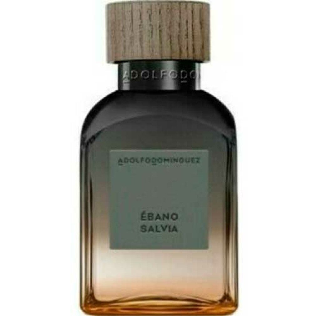 Flacone di profumo con tappo in legno. Scritta: ADOLFODOMINGUEZ, ÉBANO SALVIA. Sfumatura dal marrone all'oro.