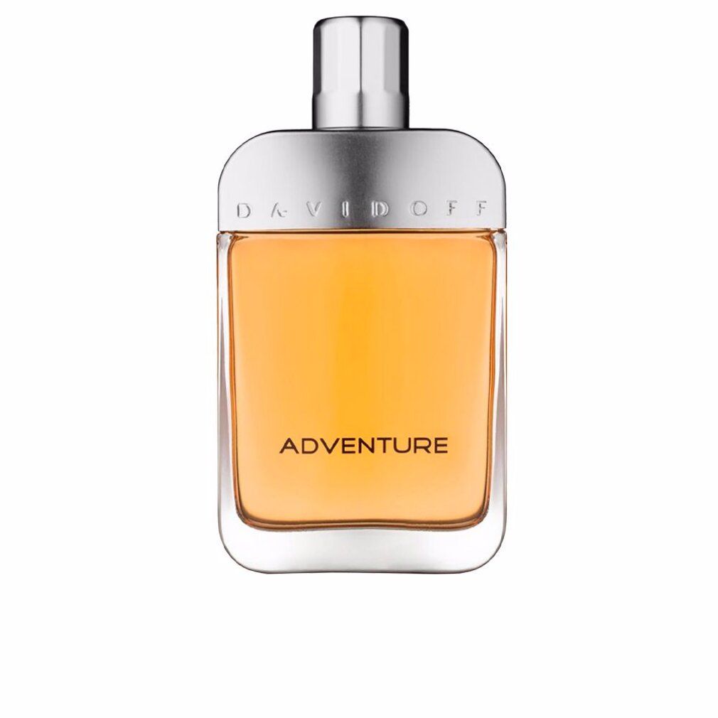 Flacone di profumo con tappo argentato e liquido giallo. Scritta 'ADVENTURE' sul flacone.