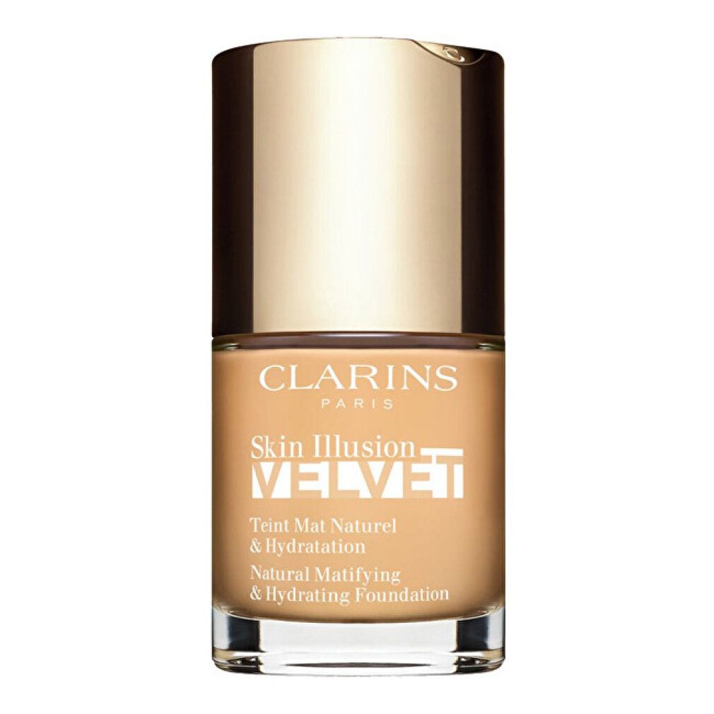 Clarins Skin Illusion Velvet Foundation. Flacone con tappo dorato. Testo: Skin Illusion Velvet, Teint Mat Naturel & Hydratation.