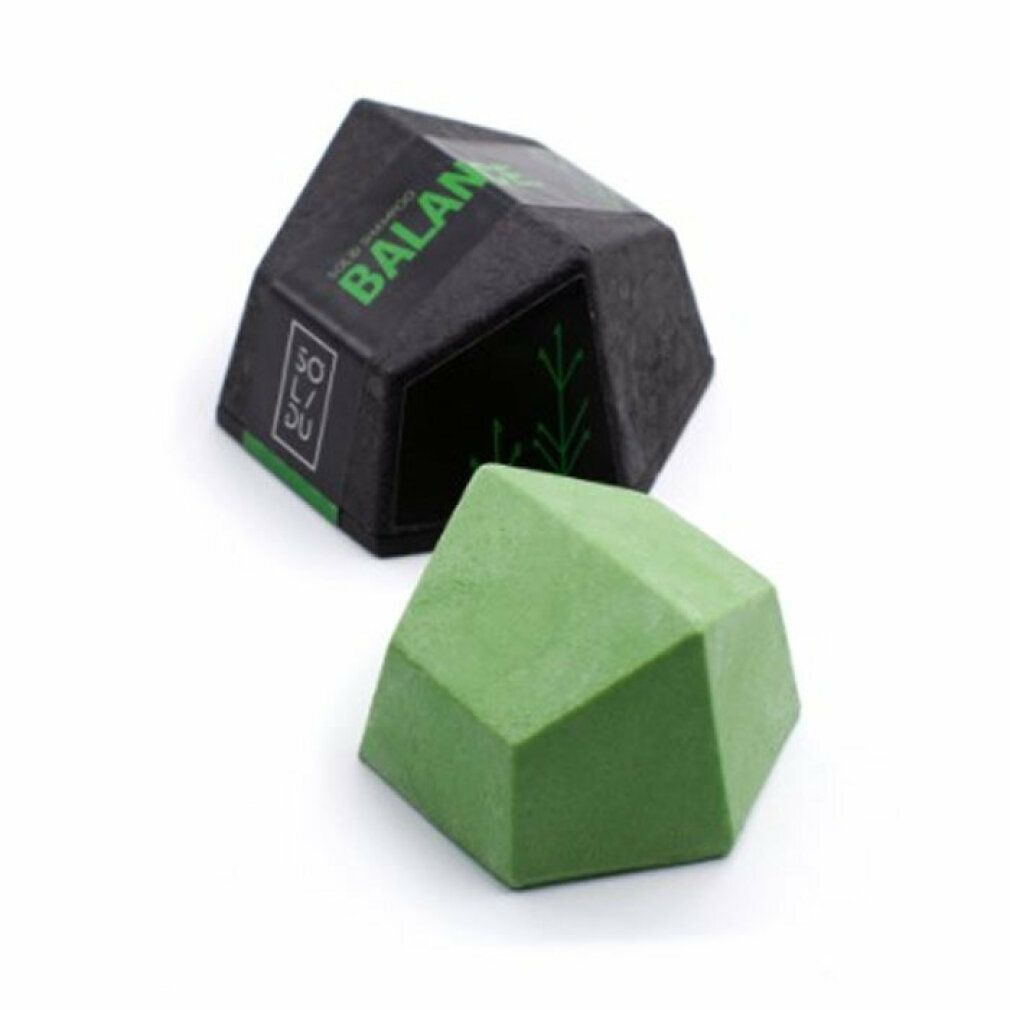 Barra shampoo verde geometrica e confezione nera con testo verde. Marchio SOL/DU e BALANCE.