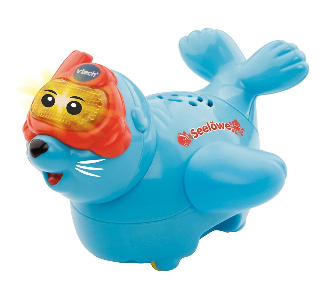 Foca blu con maschera da sub rossa. Scritta "Seelöwe". Marchio VTech. Giocattolo per bambini.