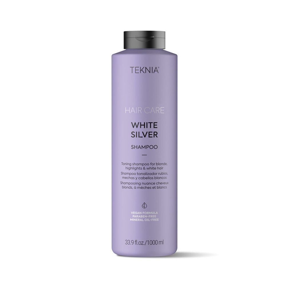 Flacone di shampoo Lakmé Teknia. Flacone viola con tappo nero. Scritta: Hair Care White Silver Shampoo. 1000ml.