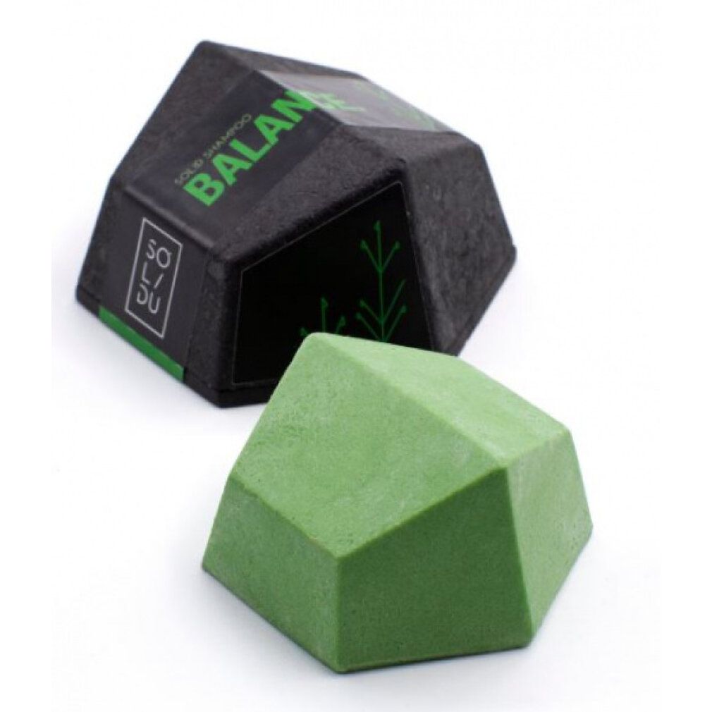 Barra shampoo verde geometrica e confezione nera con testo verde. Marchio SOL/DU e BALANCE.