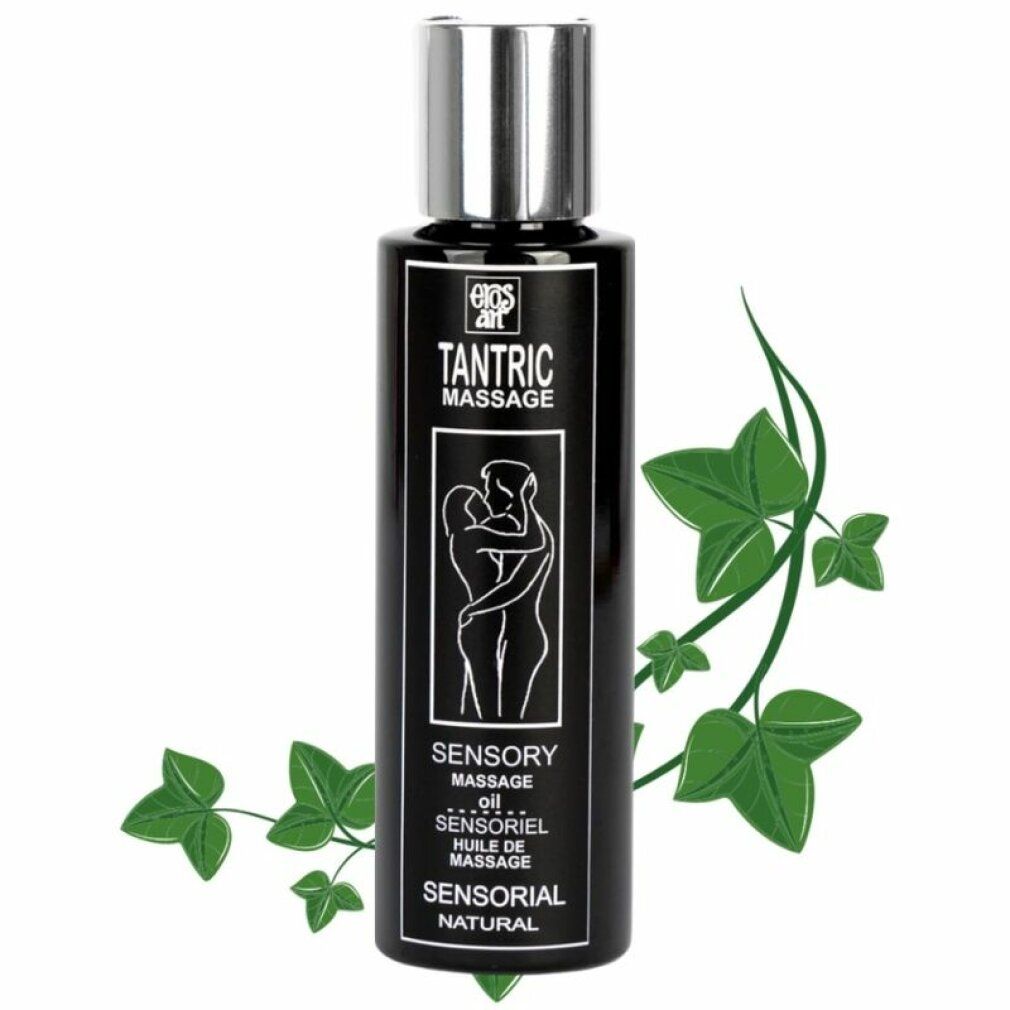 Flacone nero con tappo argentato. Scritta: Tantric Massage, Sensory Massage Oil. Pianta verde sullo sfondo.