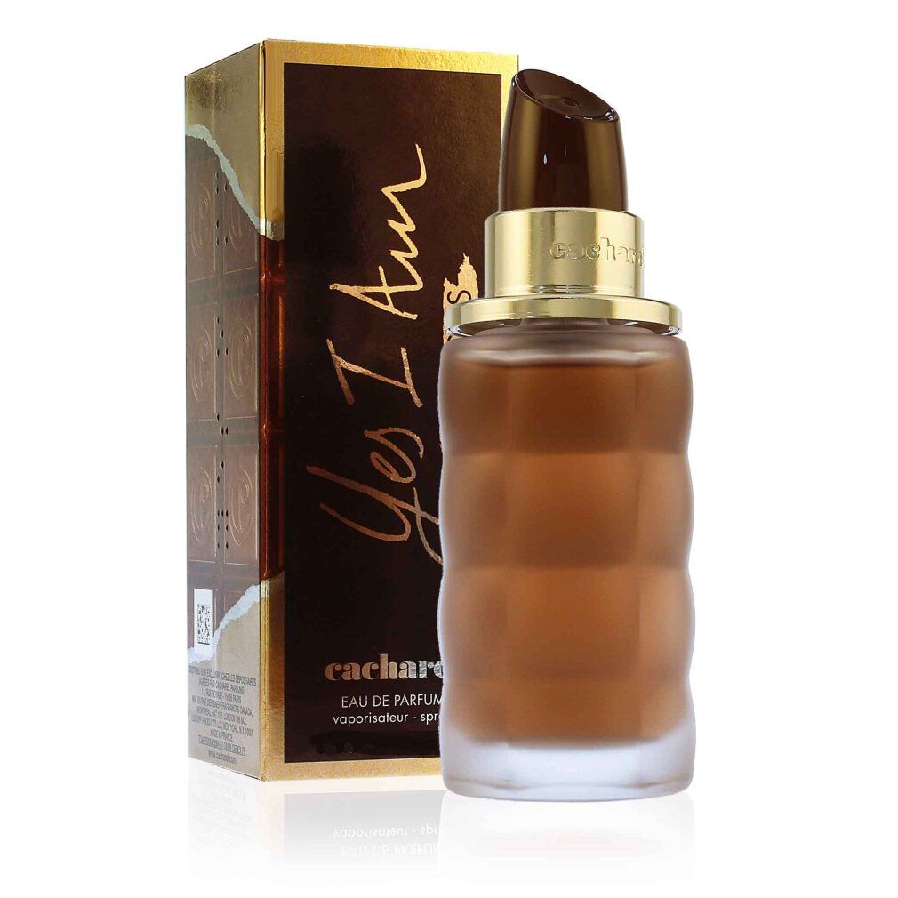 Flacone di profumo e confezione. Flacone marrone, rotondo, scanalato. Confezione marrone con scritta Yes I Am Delicious.