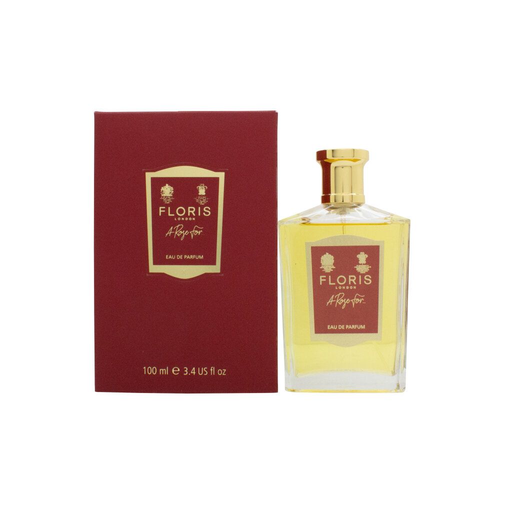 Flacone di profumo e confezione. Flacone rettangolare con tappo dorato. Confezione rossa con logo e scritta.