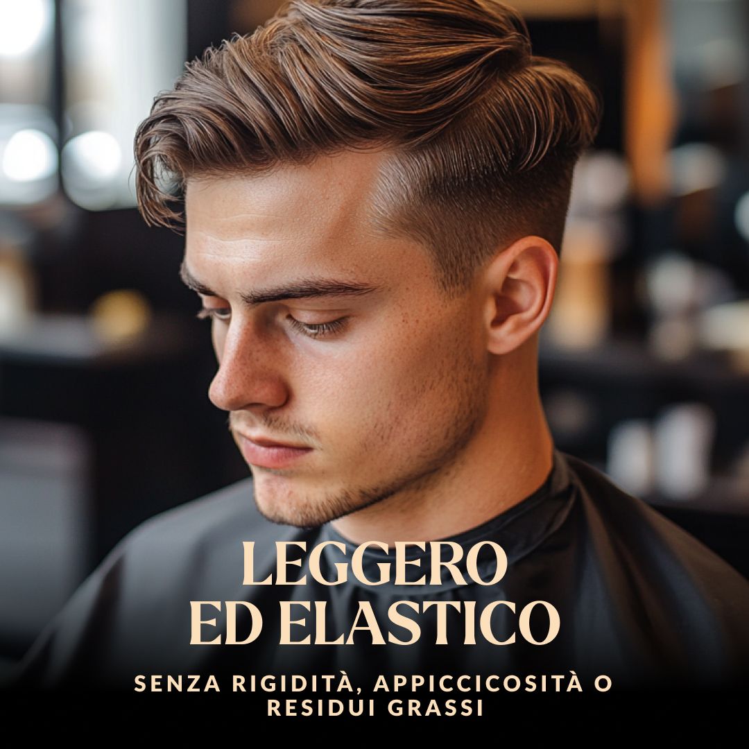 Uomo con acconciatura voluminosa ed elastica, indossa un mantello nero.