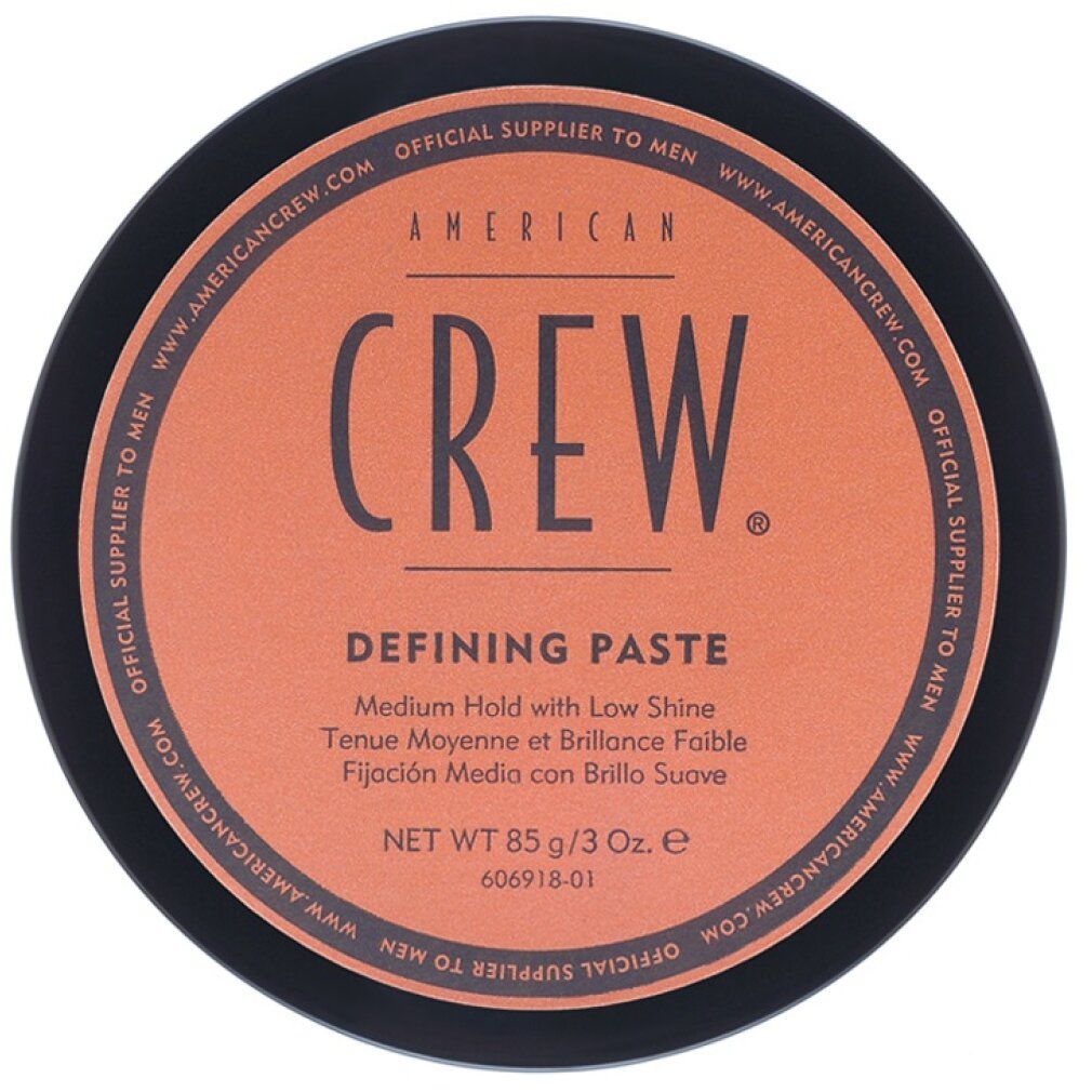 Vasetto nero con scritta marrone "American Crew Defining Paste".