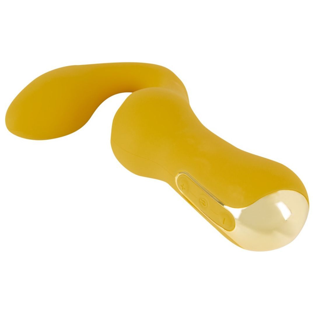 Vibratore giallo dalla forma curva, accento dorato e pulsanti di controllo.