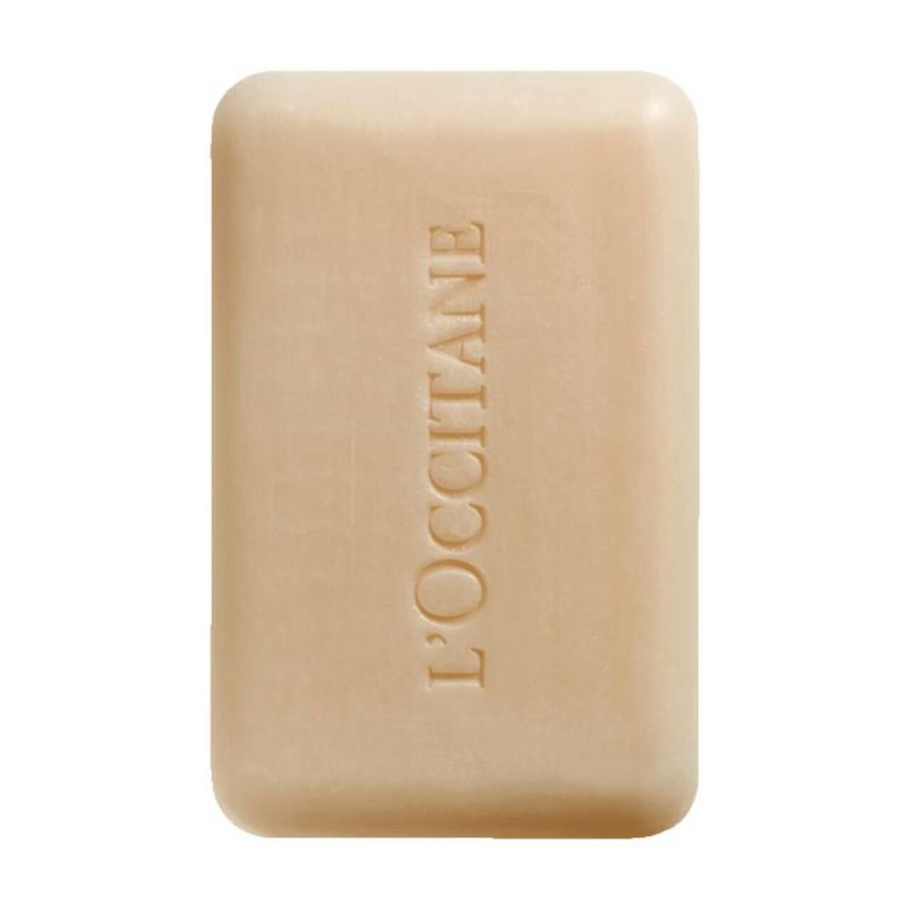 Sapone beige rettangolare con bordi arrotondati. Inciso: L'OCCITANE.