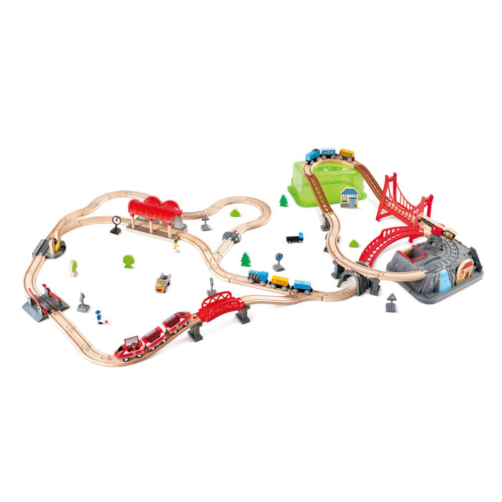 Set di costruzioni ferroviarie con ponti, edifici e treni. Include ponti rossi e marroni, colline verdi e rocce grigie.