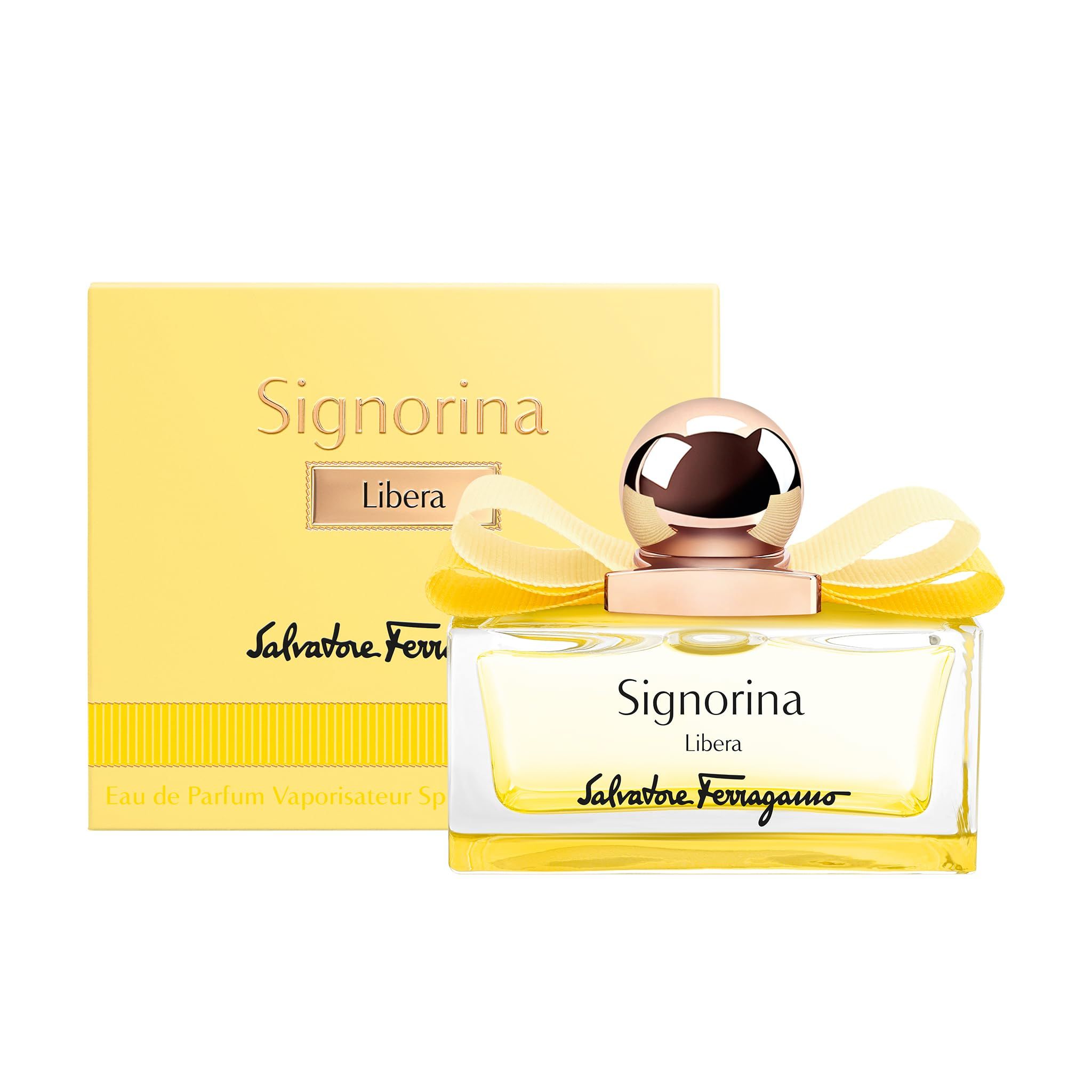 Confezione gialla e flacone. Flacone con liquido giallo, tappo dorato e fiocco giallo. Scritta Signorina Libera.