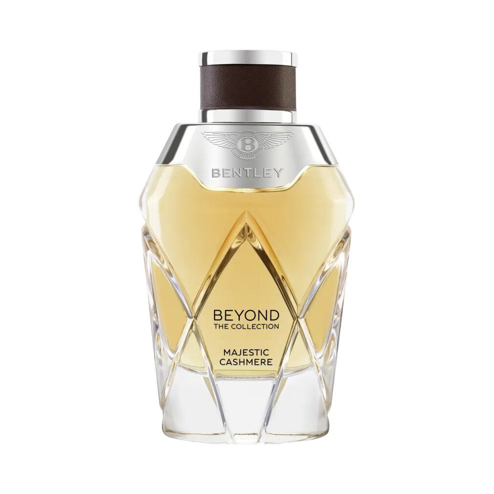 Bentley Majestic Cashmere Eau de Parfum Spray. Flacone sagomato con tappo argentato. Flacone in vetro trasparente con liquido dorato.