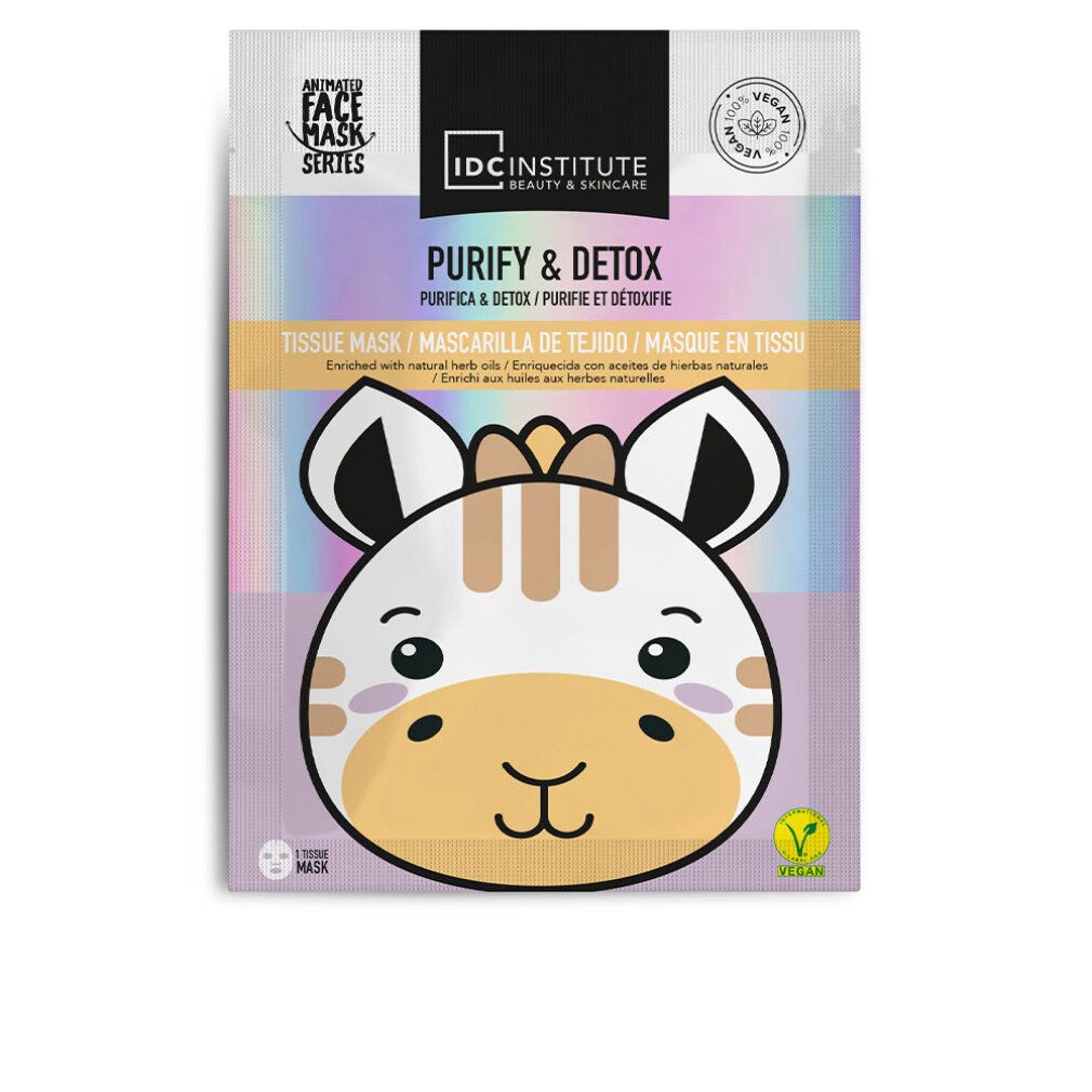 Maschera viso con design giraffa. Confezione con scritte 'Purify & Detox' e 'IDC Institute'. Sigillo vegano.