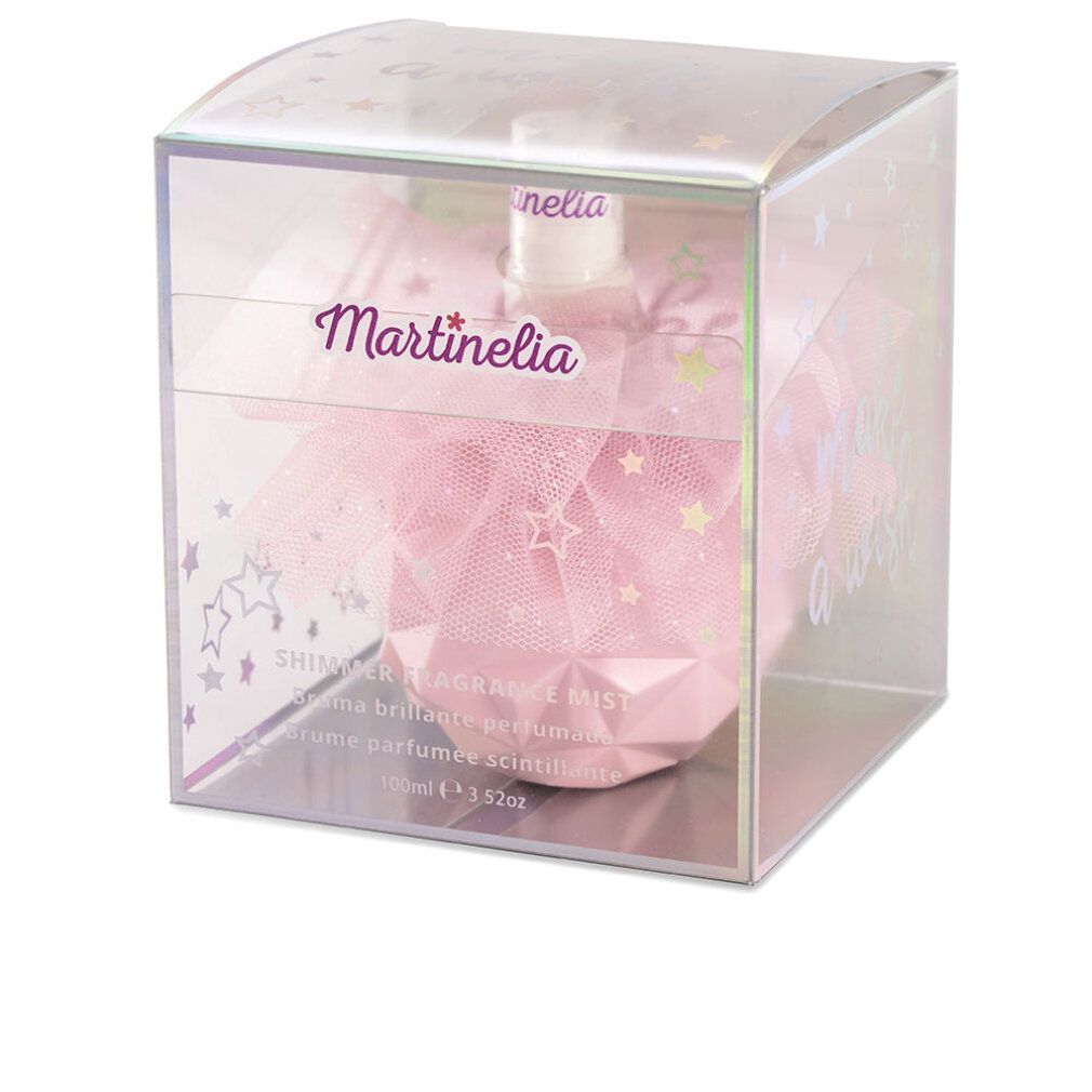 Flacone rosa in scatola trasparente. Scritta Martinelia. Testo: Shimmer Fragrance Mist. Stelle e glitter.