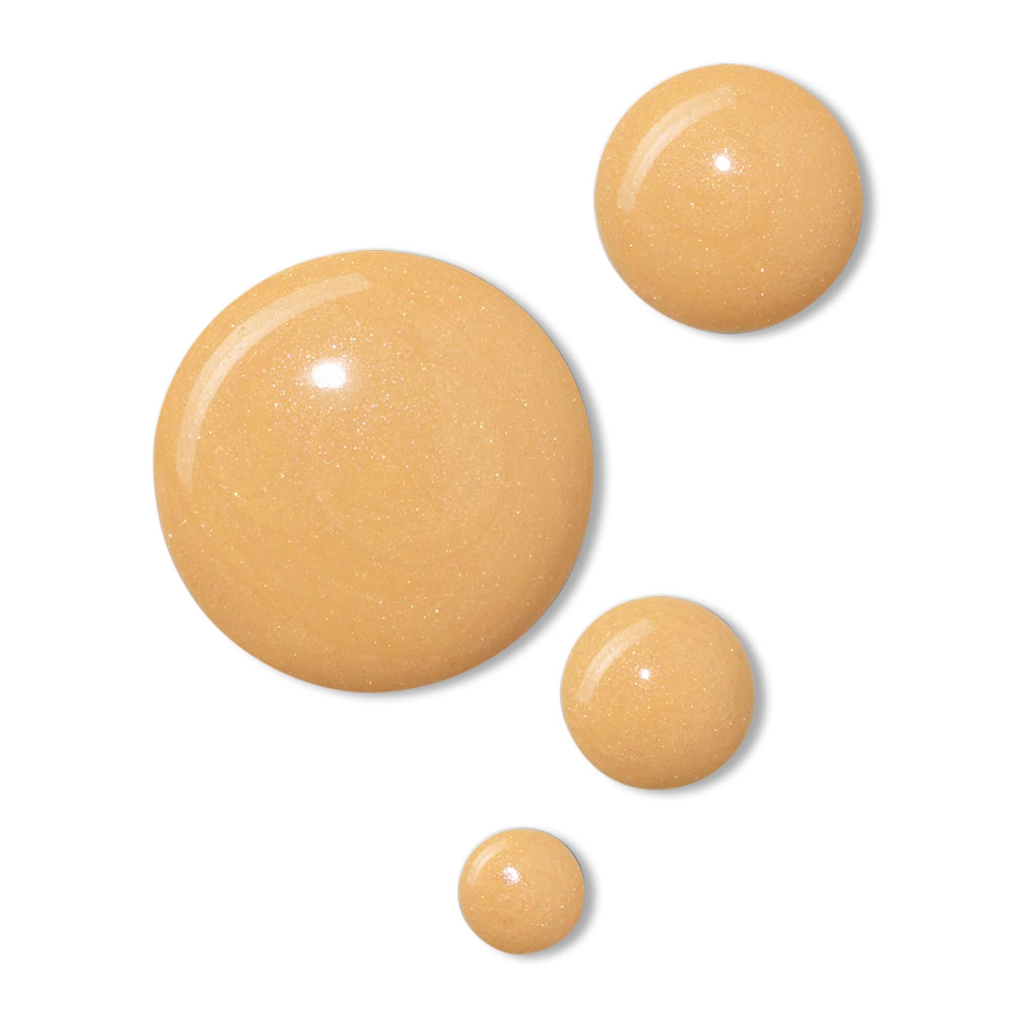 Quattro gocce rotonde beige su sfondo bianco. Texture scintillante.