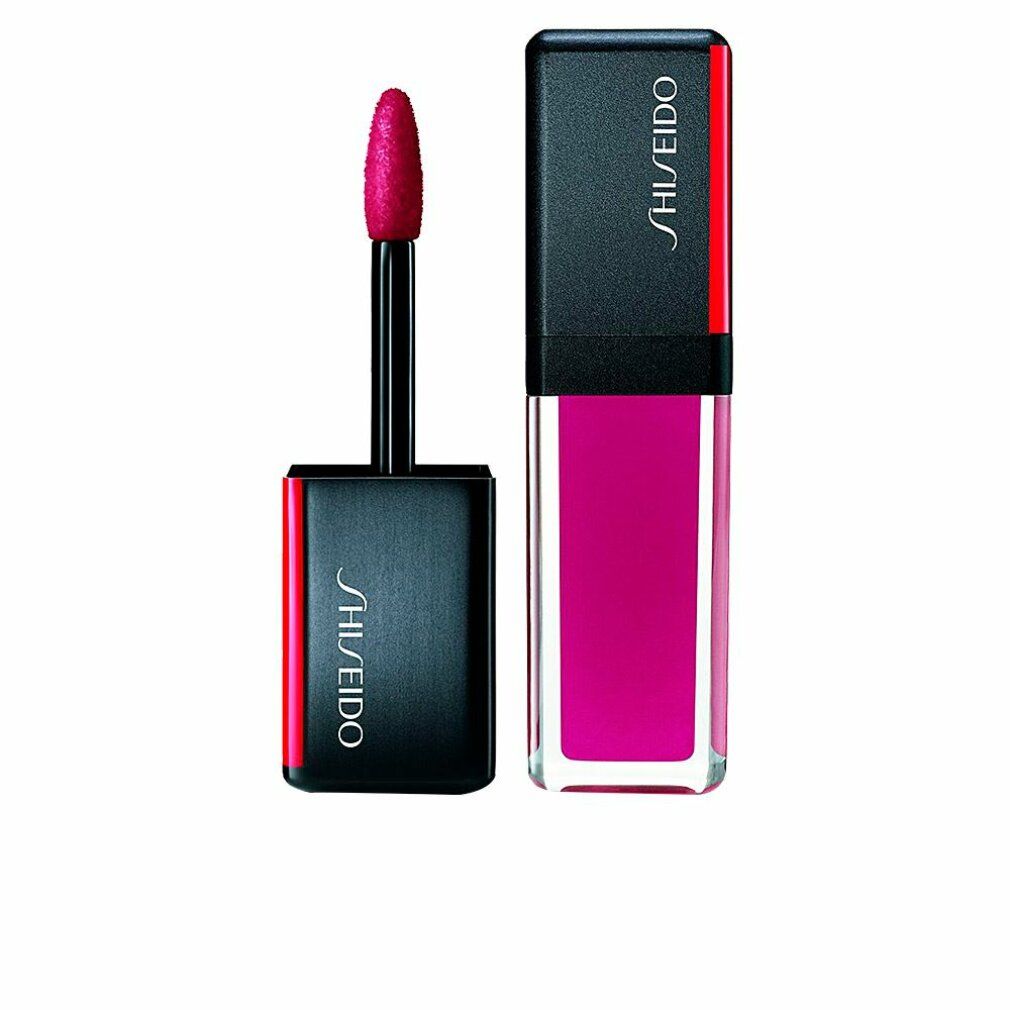Rossetto con applicatore. Tappo nero con dettaglio rosso e logo Shiseido. Colore rosa in un contenitore trasparente.