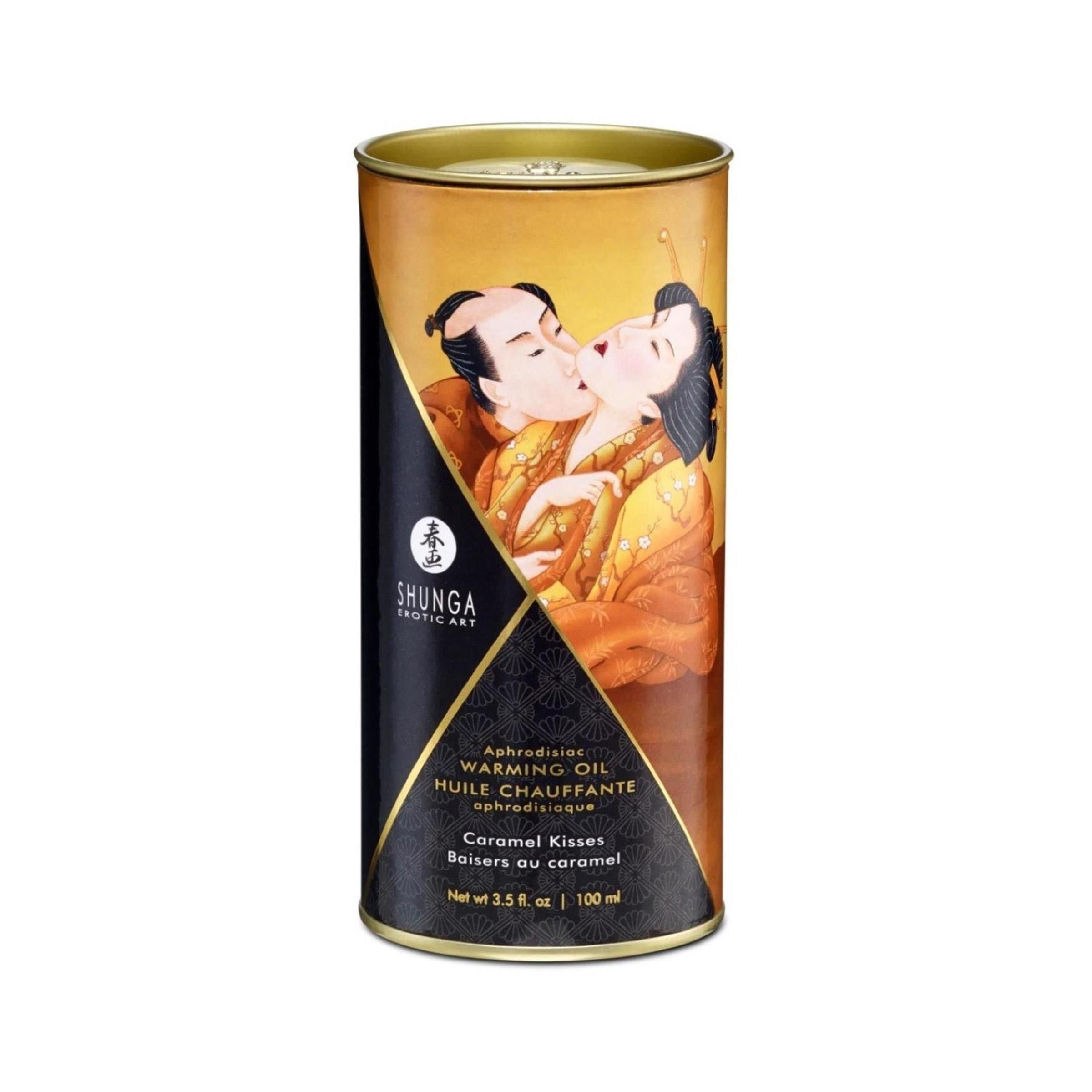 Scatola cilindrica con coperchio dorato. Illustrazione di una coppia che si bacia. Etichetta nera con informazioni sul prodotto.