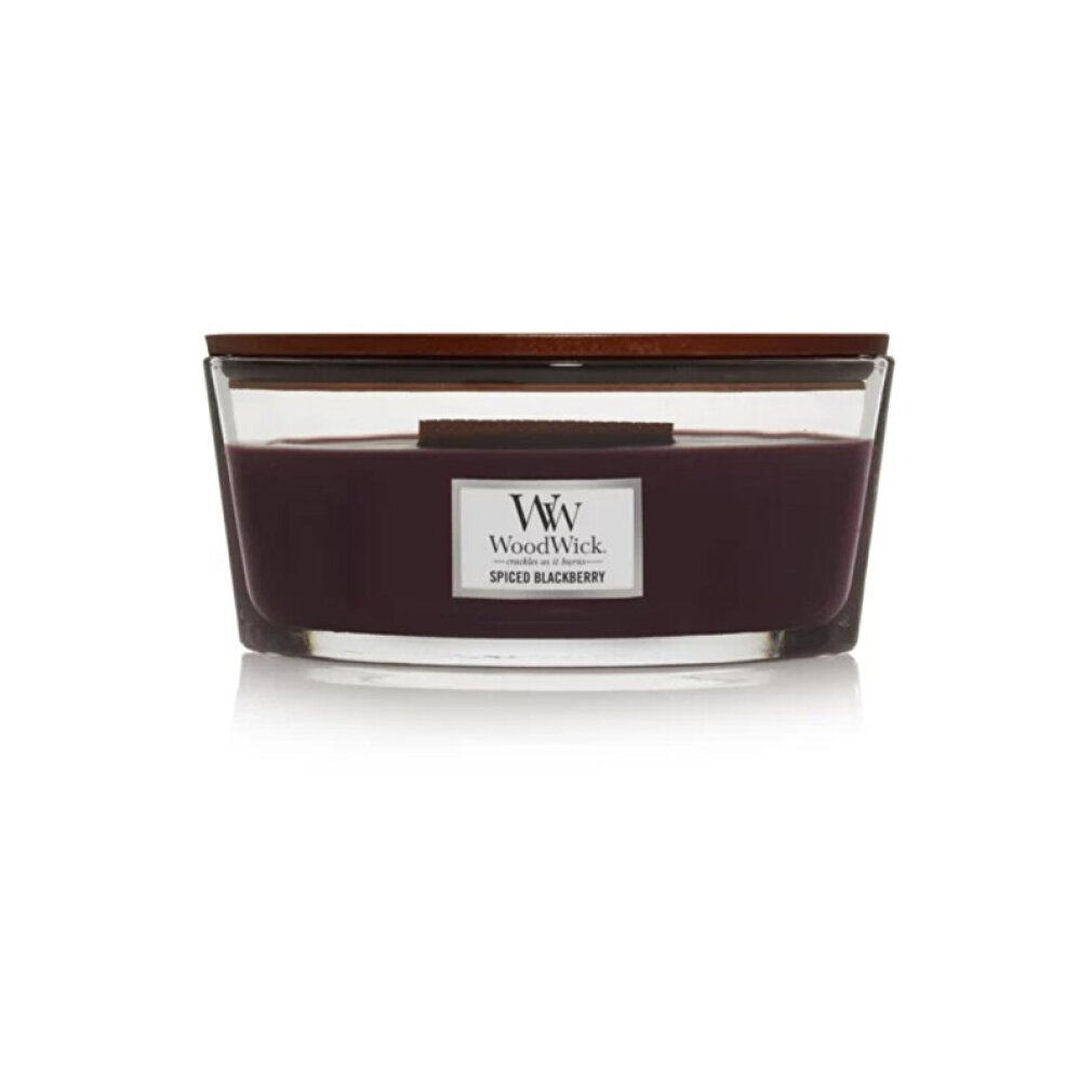 Candela con coperchio in legno. Cera viola in contenitore di vetro. Scritta: WoodWick Spiced Blackberry.