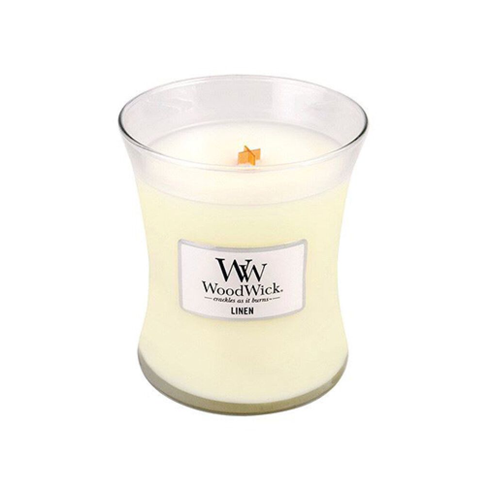 Candela a forma di clessidra con stoppino. L'etichetta riporta "Linen" e il logo WoodWick.