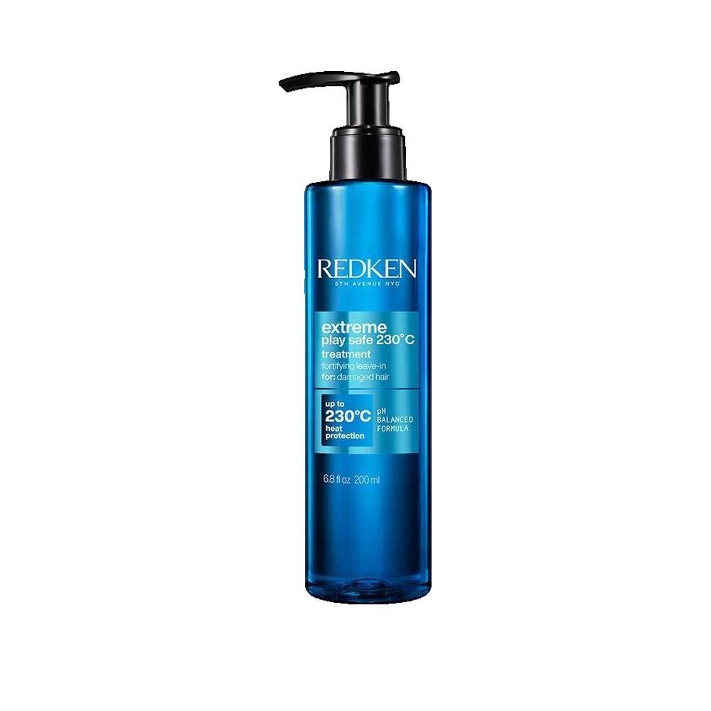 Flacone blu trasparente con erogatore nero. Scritta: Redken, Extreme Play Safe, protezione termica 230°C.