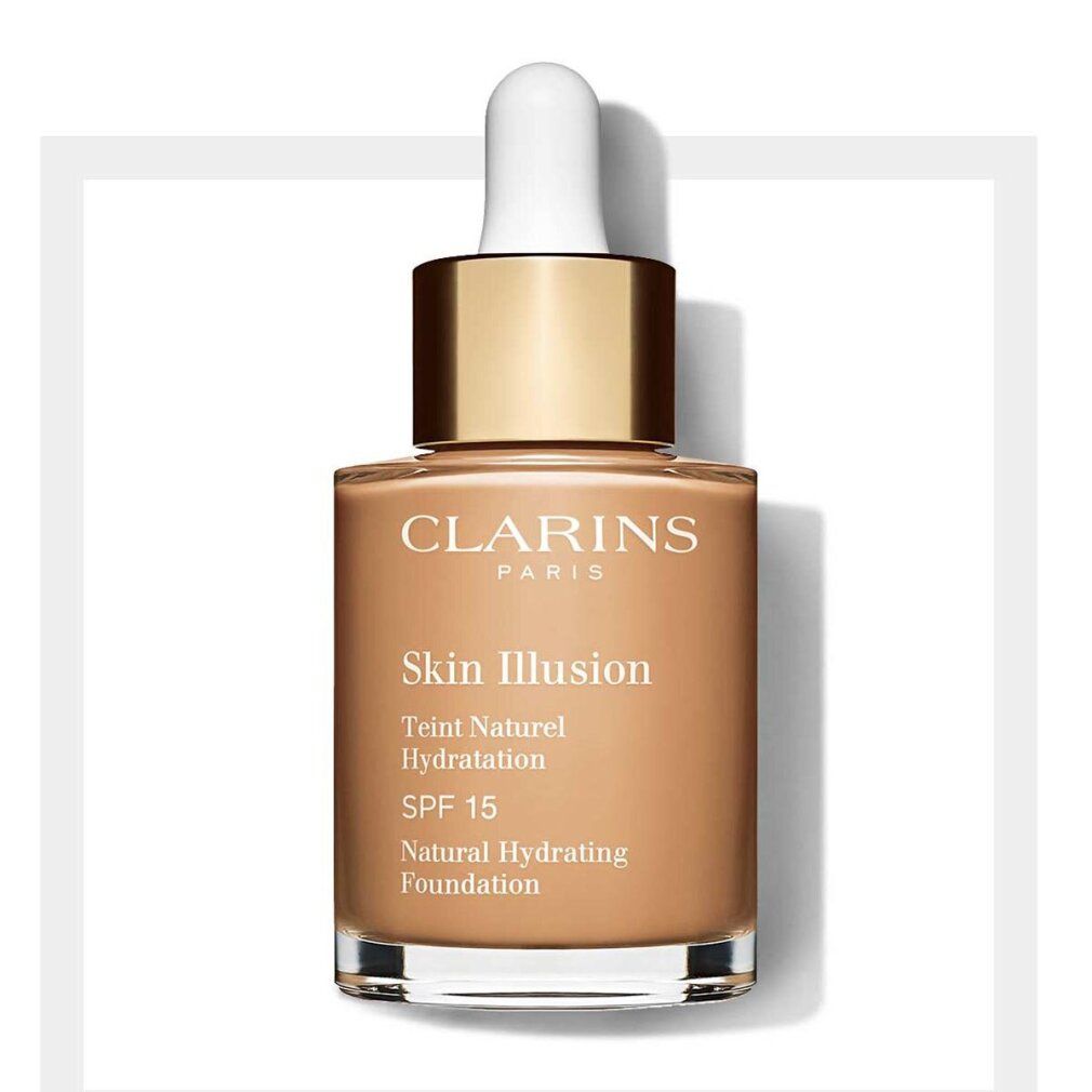 Fondotinta liquido in flacone di vetro con contagocce. Scritta: Clarins, Skin Illusion, Teint Naturel Hydratation, SPF 15, Natural Hydrating Foundation.