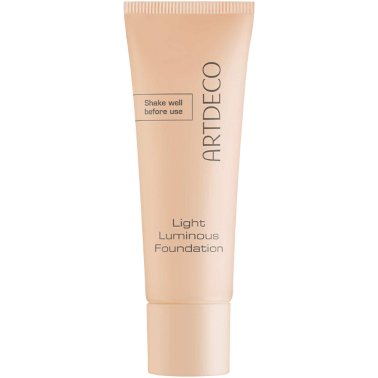 Tubo beige di fondotinta Artdeco Light Luminous. Scritta: Shake well before use. Nome del prodotto e marchio visibili.