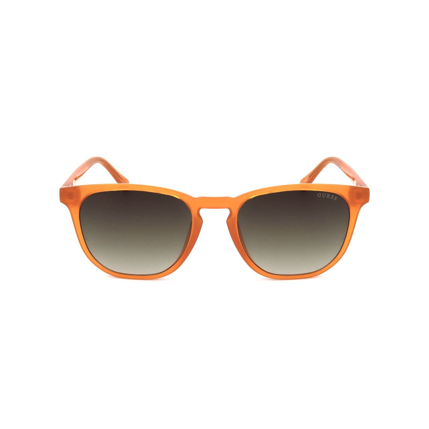 Occhiali da sole arancioni con lenti scure e il nome del marchio 'GUESS' sul braccio.