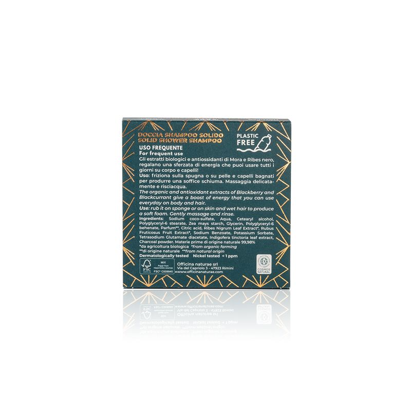 Retro di una scatola verde con testo. Testo: Doccia Shampoo Solido, Uso Frequente, Plastic Free. Contiene informazioni sugli ingredienti e l'uso.