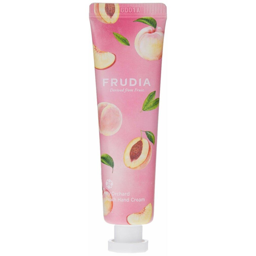 Tubo rosa con motivo pesca e scritta FRUDIA. Nome prodotto: My Orchard Peach Hand Cream. Chiusura bianca.