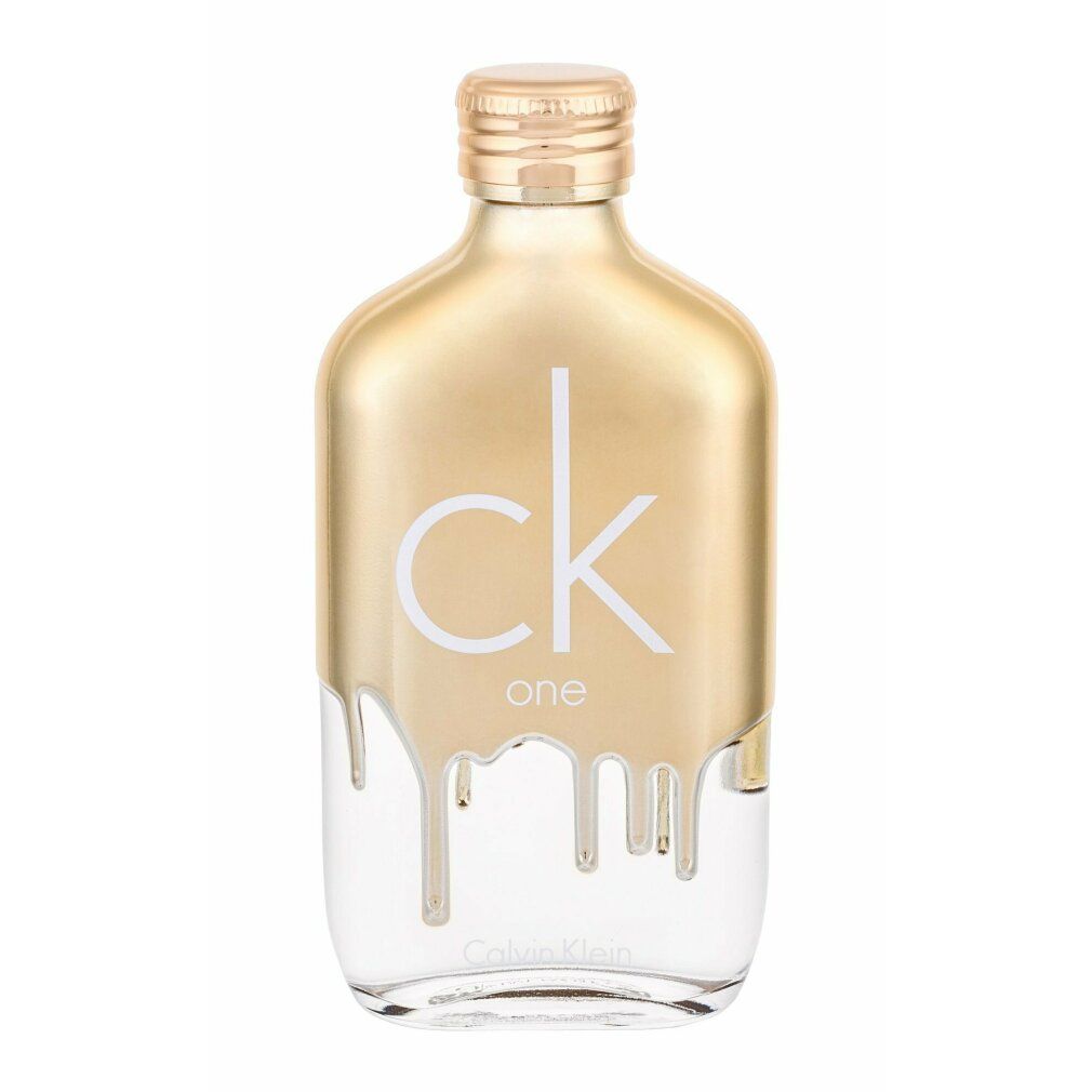 Flacone dorato con scritta bianca « ck one ». Parte inferiore trasparente. Design a goccia. Logo Calvin Klein.
