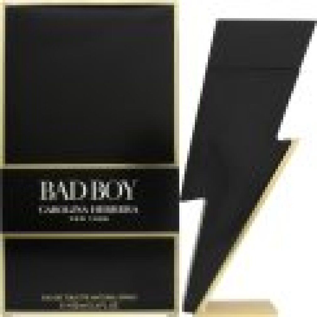 Confezione nera e flacone a forma di fulmine. Scritta: Bad Boy, Carolina Herrera. Dettagli dorati.