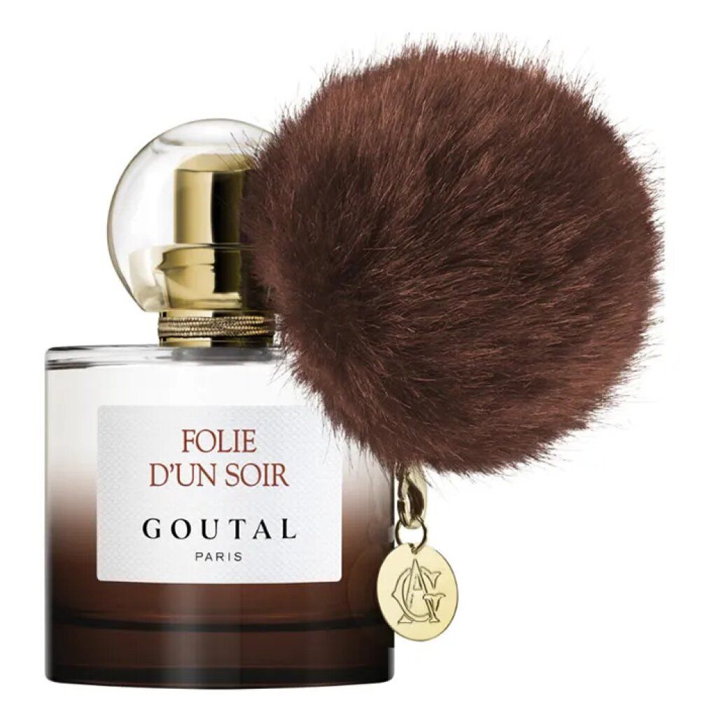Flacone di profumo con pennello marrone e ciondolo. Scritta: Folie d'Un Soir, Goutal Paris. Flacone in vetro.