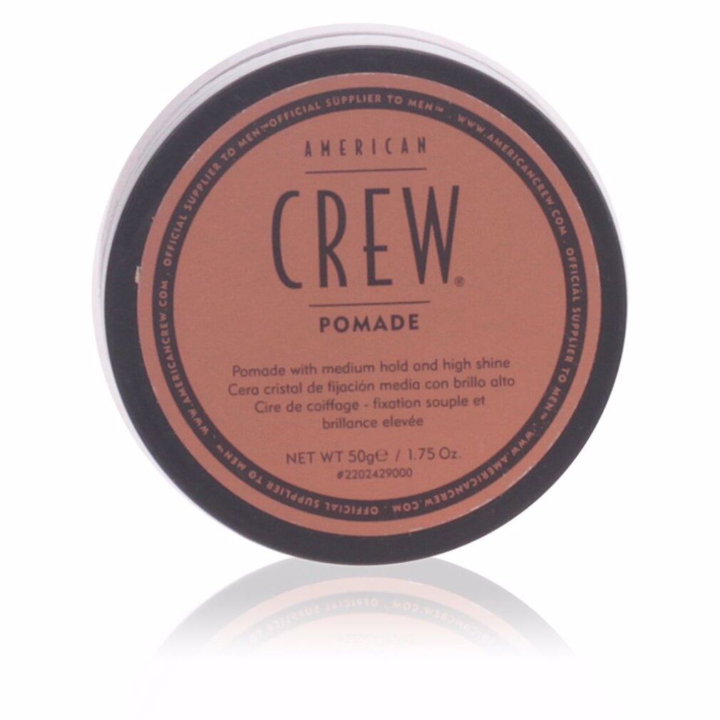 Barattolo nero rotondo con coperchio marrone. Scritta: AMERICAN CREW. Pomade. Netto 50g/1.75 Oz. Riflesso.