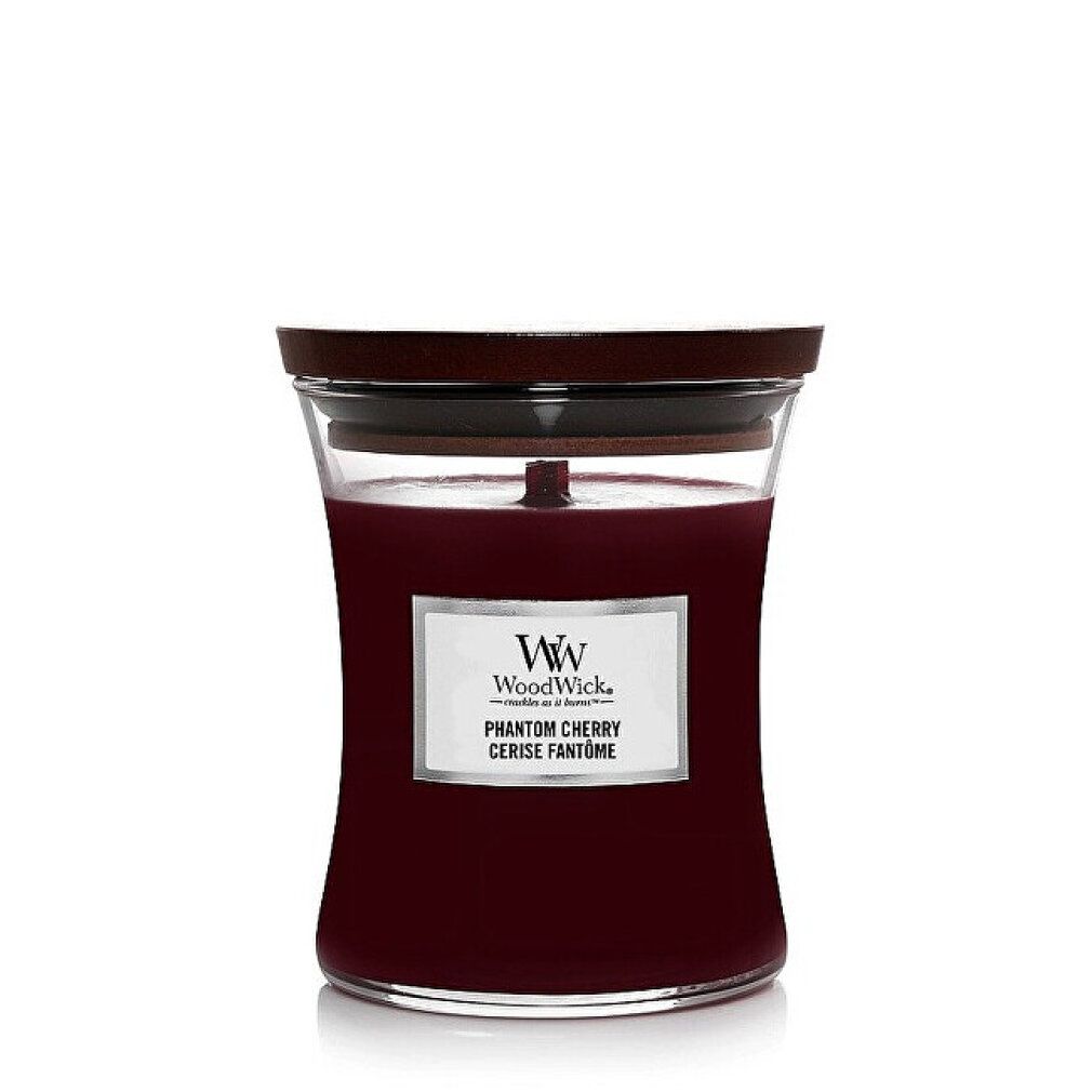 Candela rossa in contenitore di vetro con coperchio in legno. Etichetta "WoodWick" e "Phantom Cherry".