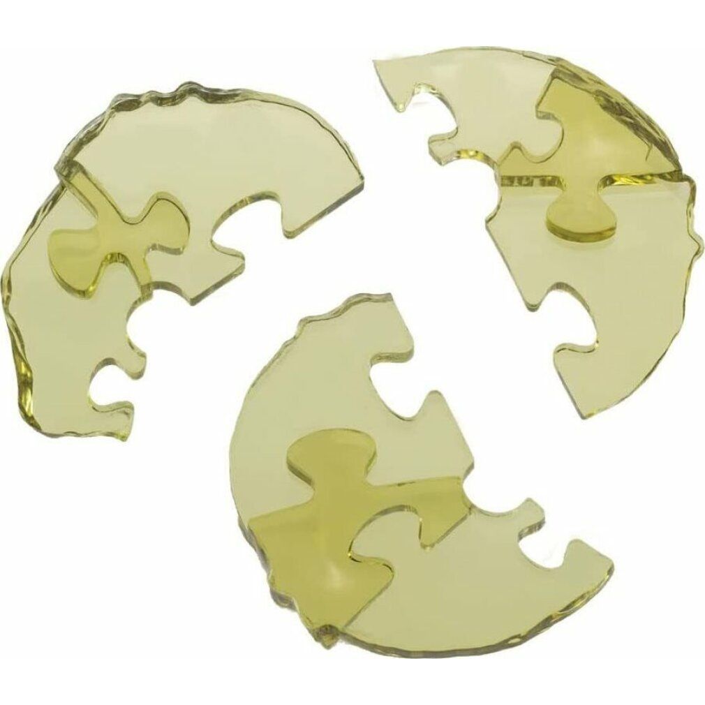 Tre pezzi di puzzle in plastica gialla trasparente. Singoli pezzi con forme ad incastro.