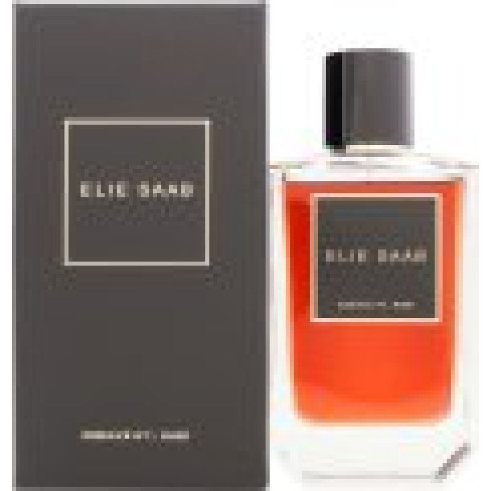 Flacone di profumo accanto a scatola rettangolare. Flacone con liquido rosso, tappo nero ed etichetta ELIE SAAB.