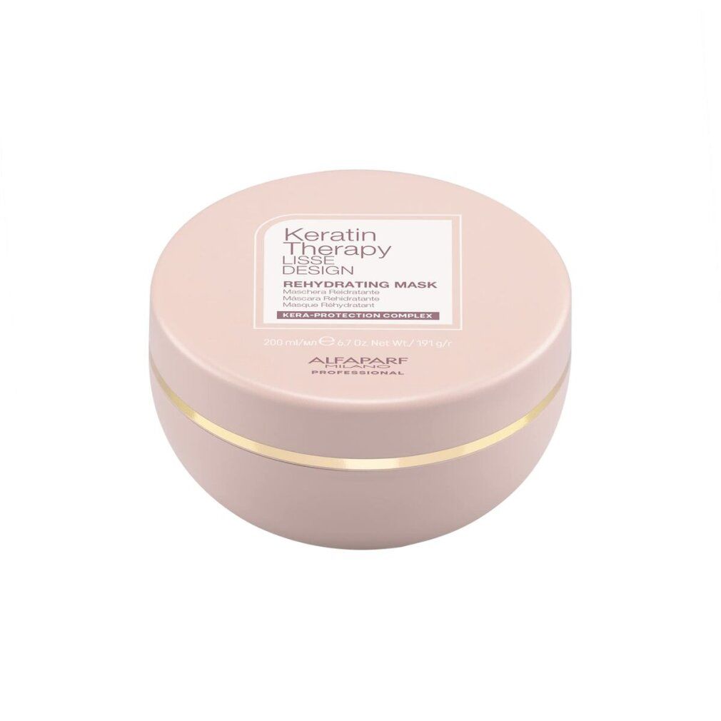 Barattolo rotondo rosa con bordo dorato. Scritta: Keratin Therapy Lisse Design Rehydrating Mask. Marchio: Alfaparf Milano Professional.