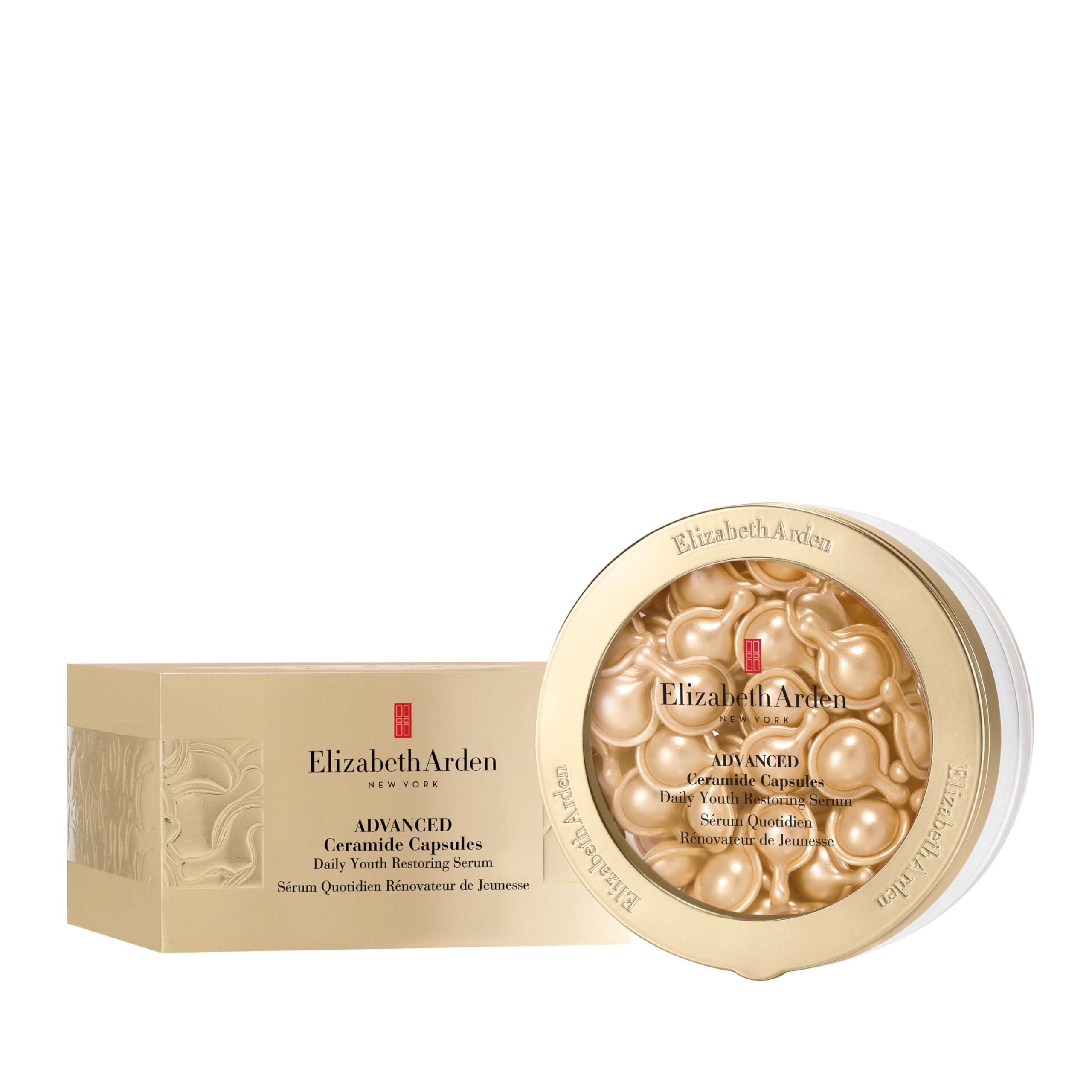 Capsule dorate in un contenitore e una scatola. Scritta: Elizabeth Arden, Advanced Ceramide Capsules, Daily Youth Restoring Serum.