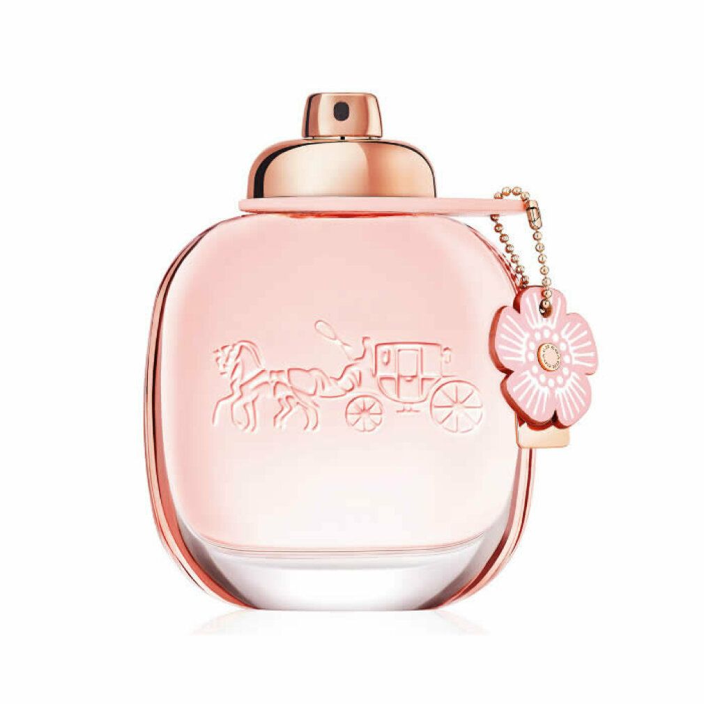 Coach Floral Eau de Parfum Spray. Flacone rosa con tappo e ciondolo dorati. Design a carrozza in rilievo.