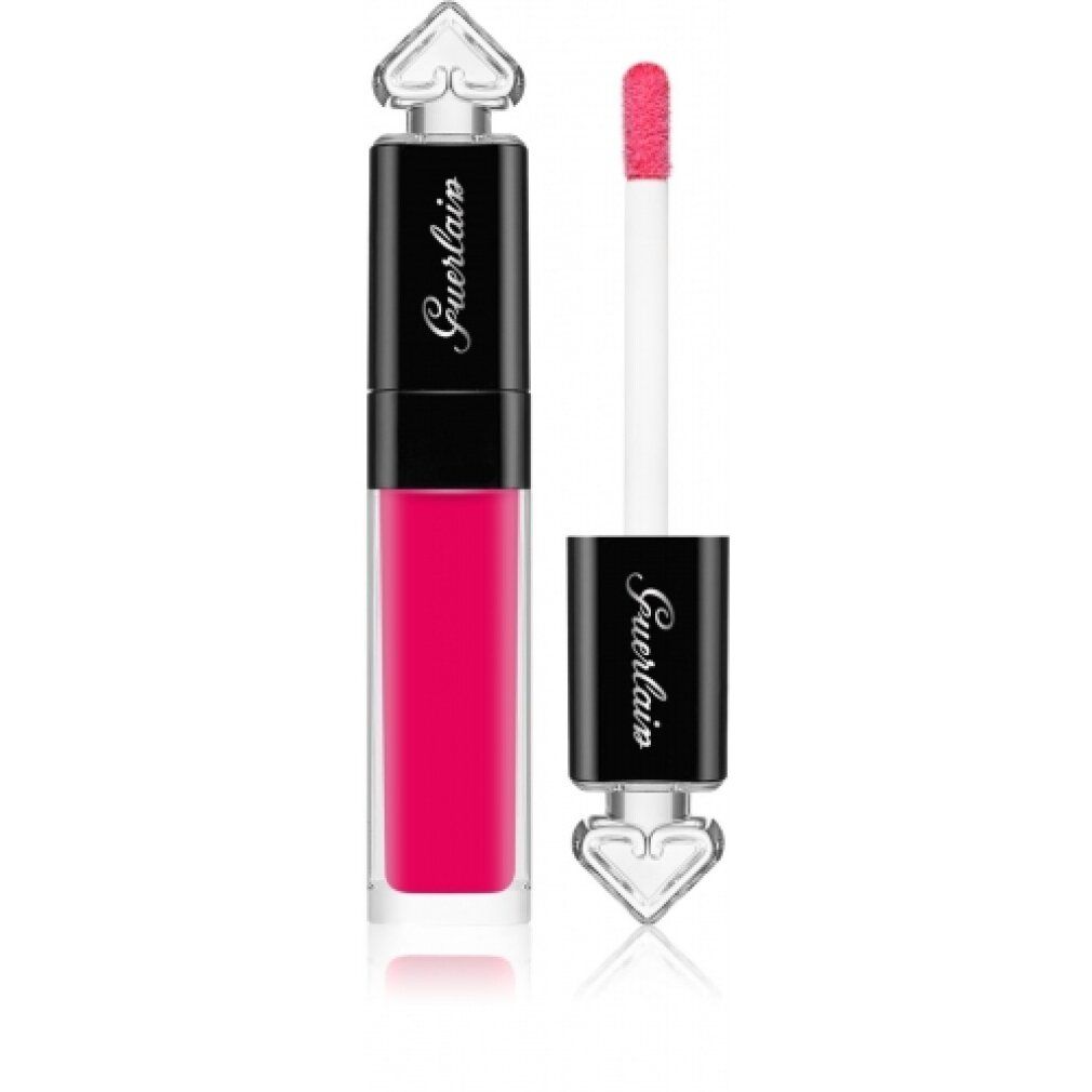 Rossetto rosa con applicatore. Il rossetto ha un flacone trasparente con tappo nero. Sul tappo è scritto Guerlain. Punta a forma di cuore.