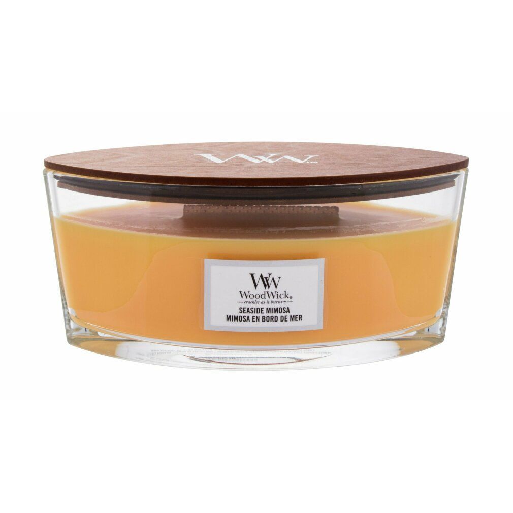 Candela Ellipse con coperchio in legno. Cera gialla in contenitore di vetro. Etichetta "WoodWick Seaside Mimosa".