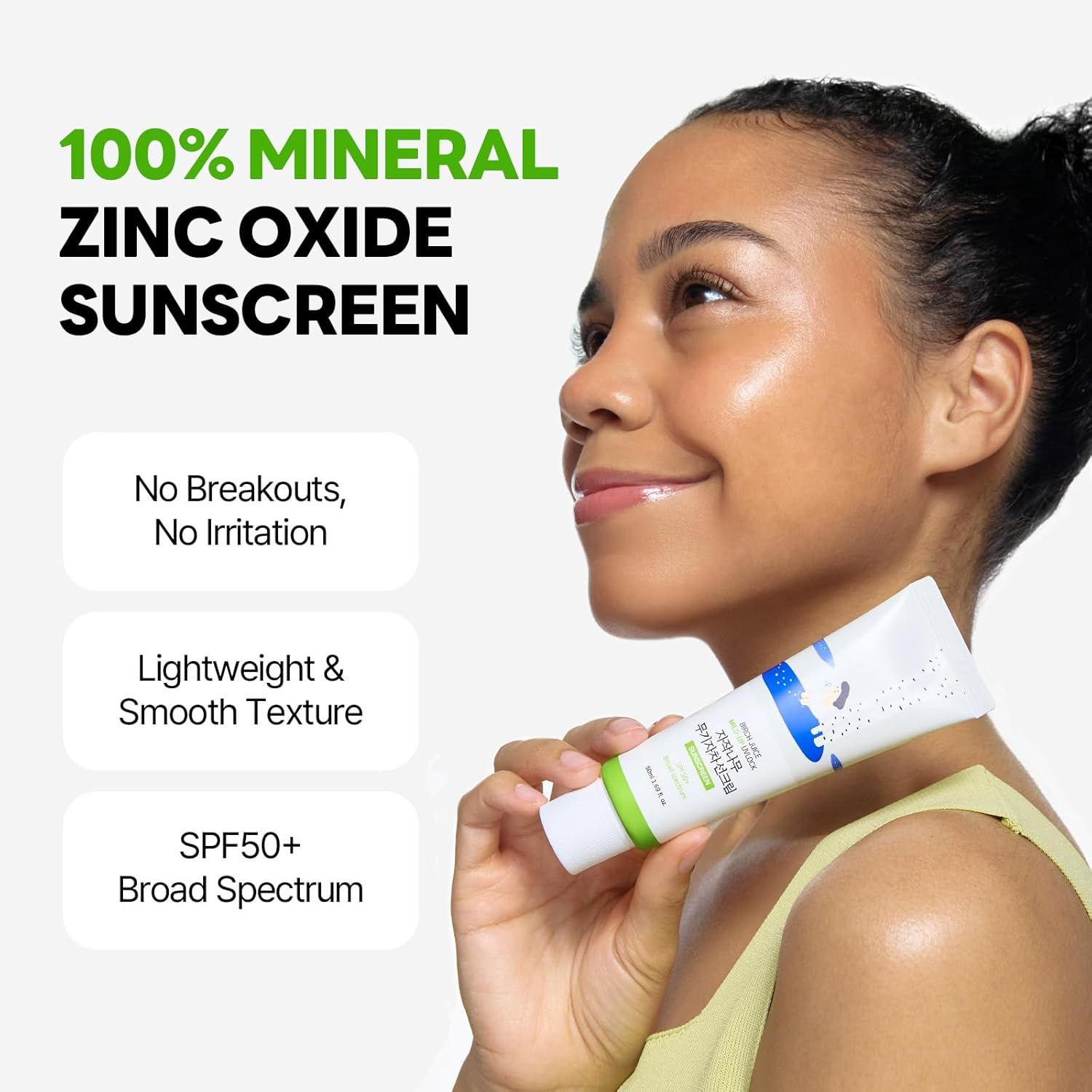Donna tiene tubo. Testo: 100% Mineral Zinc Oxide Sunscreen. Nessun sfogo, nessuna irritazione. SPF50+.