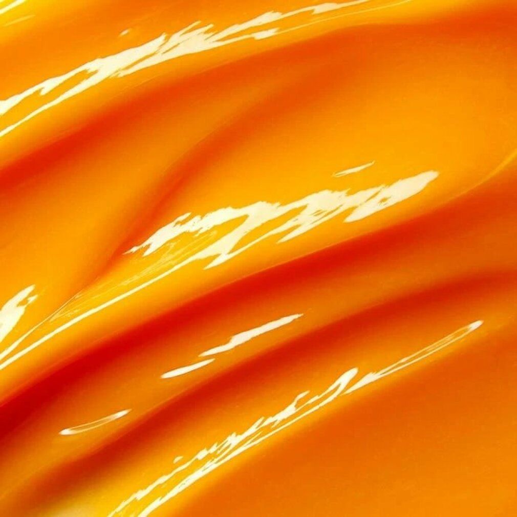 Crema arancione con onde lucide e riflessi di luce.