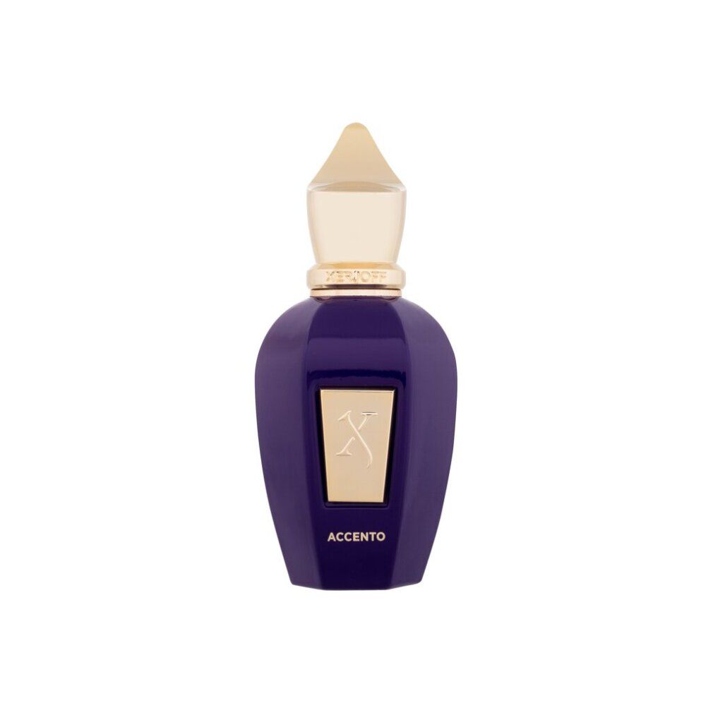 Flacone di profumo blu-viola con tappo dorato. Logo X dorato e scritta ACCENTO sul davanti.