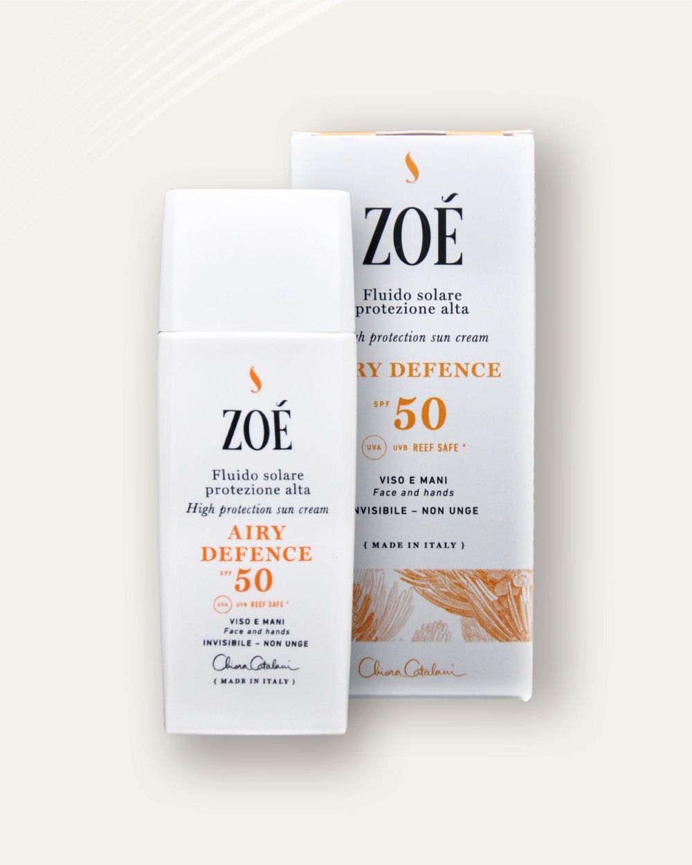 Flacone bianco e scatola. Testo arancione: AIRY DEFENCE SPF 50. Testo: Fludo solare protezione alta. Marchio: ZOÉ.