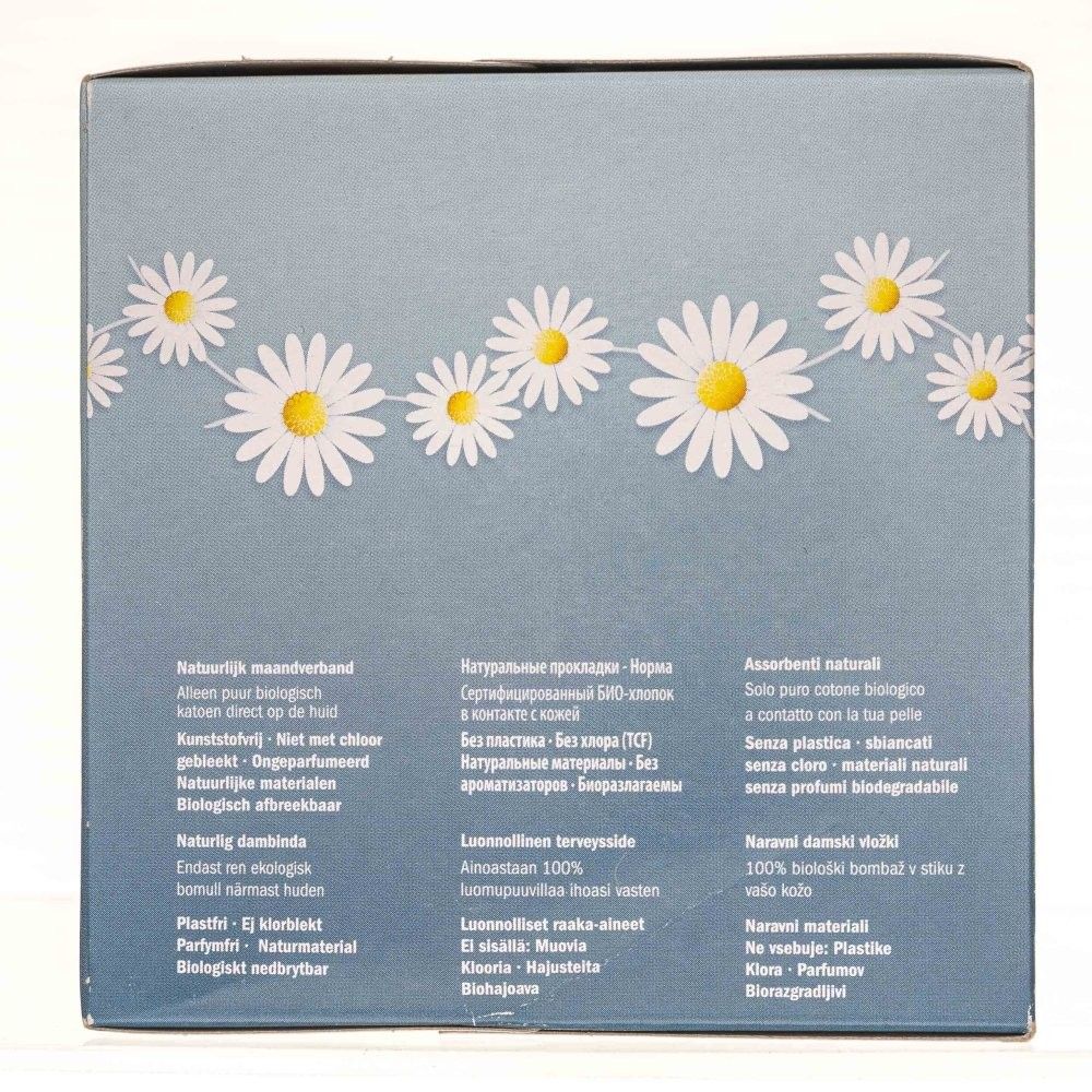 Confezione con motivo margherite, testo multilingue.