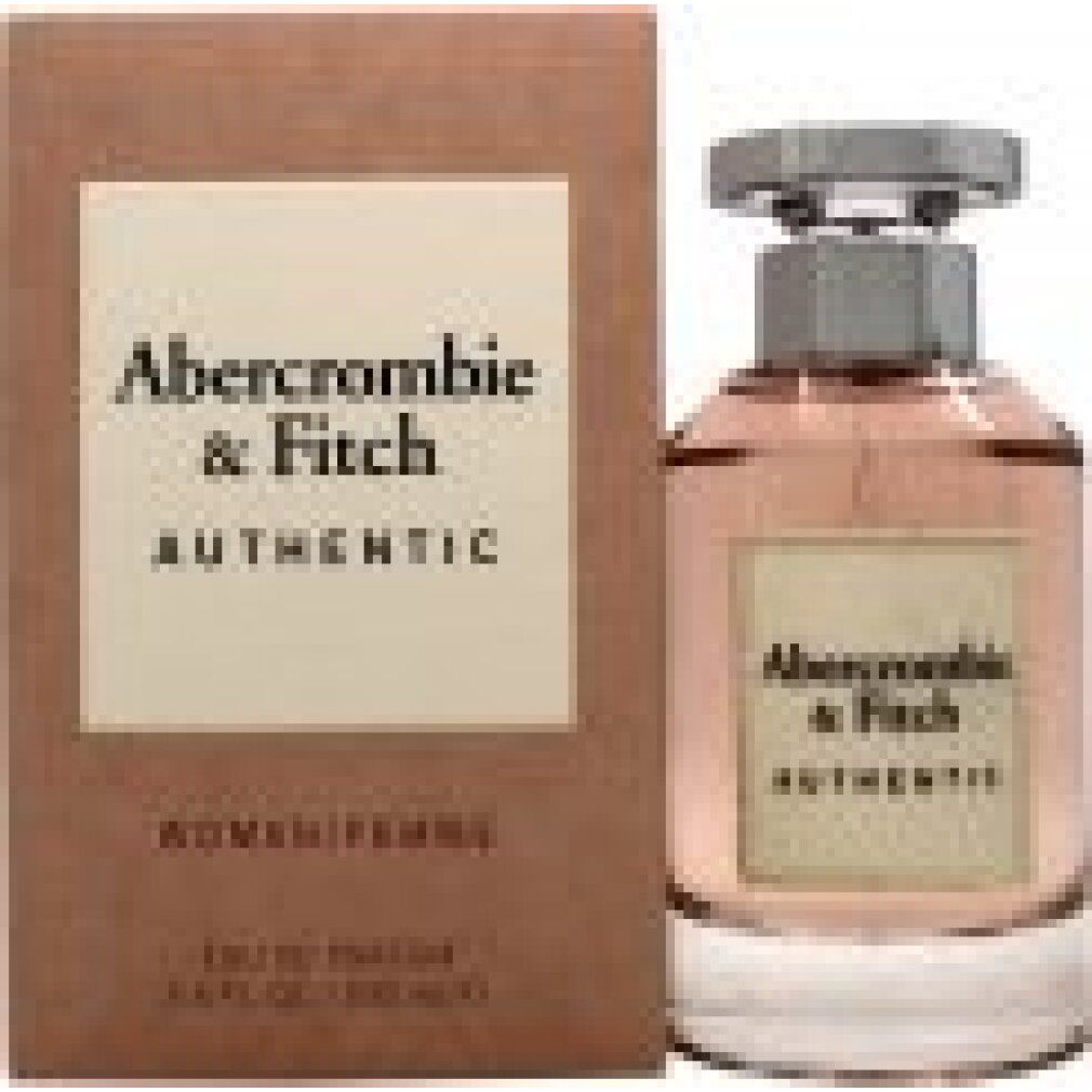 Flacone di profumo e confezione. Flacone con tappo argentato, liquido rosa. Confezione con logo e testo.