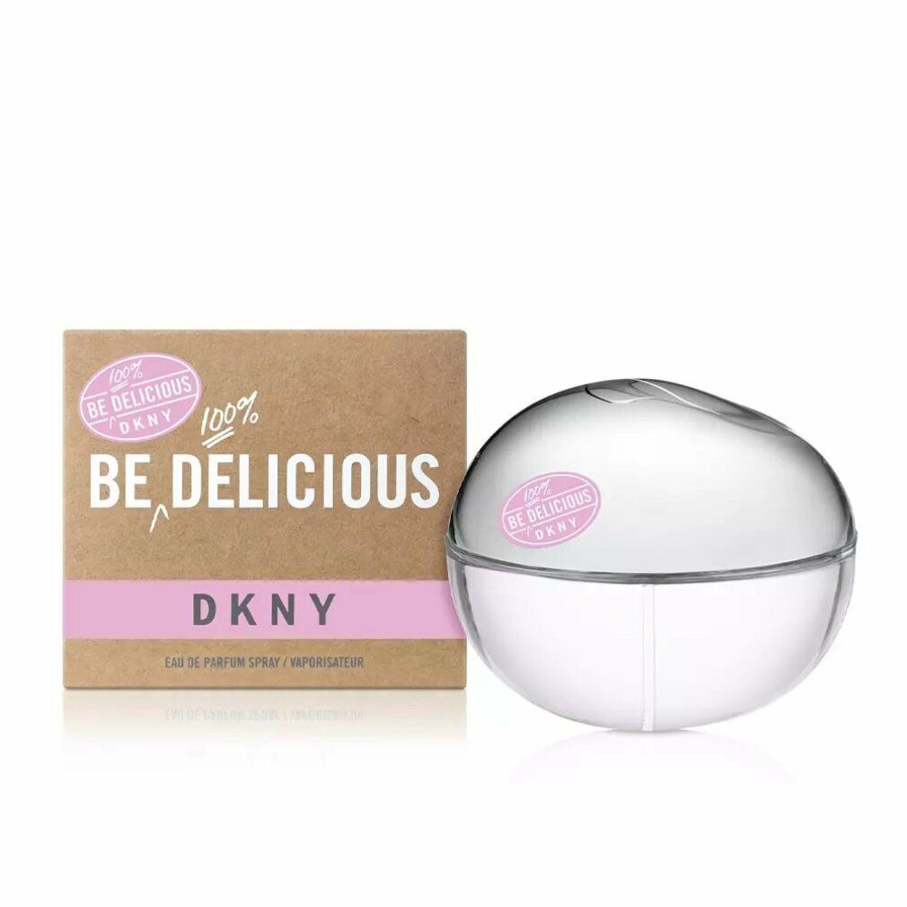 Flacone rotondo accanto a confezione marrone. Adesivo rosa con testo: Be Delicious DKNY. Confezione con testo.