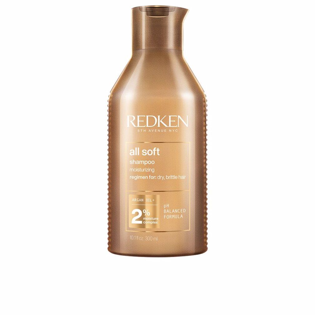 Flacone di shampoo dorato. Scritta: Redken, all soft shampoo. Contiene olio di argan e complesso idratante al 2%. Formula pH bilanciata.